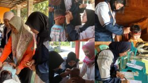 Mahasiswa KKN Universitas Diponegoro pada kegiatan Posyandu (Foto: Dok. KKN Undip).
